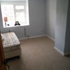 Photo 7: This is the larger bedroom.