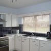 Photo 2: Well equipped kitchen with double oven, dishwasher, microwave, coffee machine.