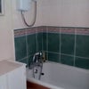 Photo 4: Bath with electric shower over