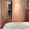 Photo 4: view of storage cupboard from bed