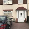 Photo 1: Front view of house