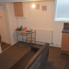 Photo 2: Open plan lounge with sofa and soft furnishings
