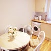 Photo 7: Kitchen table expands to seat more people