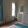 Photo 5: Large room facing front, bright and sunny!