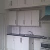 Photo 2: Kitchen area, with space for fridge.