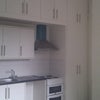 Photo 3: Kitchen area showing built-in wardrobe