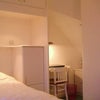 Photo 4: TV/DVD, wi-fi, literature holders, desk + lamp, filing cabinet.
