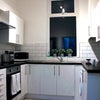 Photo 3: Modern kitchen, with washing machine, tumble dryer, two fridges, microwave