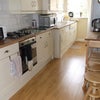 Photo 3: Kitchen with own fridge and own cupboards