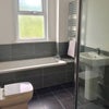 Photo 3: Brand new large bathroom and shower units by Victoria Plumbing