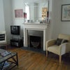Photo 7: Bright sitting room with high ceilings