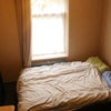 Photo 1: Your bedroom, maybe? Double bed, wardrobe and part of the chest of drawers visible