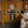 Photo 7: Hey it's a kitchen. The living room is through the arch on the left