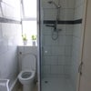 Photo 8: Toilet and shower combined