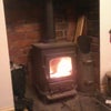 Photo 3: The woodburner in the main living room 