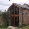 Photo 5: Front entrance with adjacent roof terrace