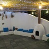 Photo 8: Meditterranean themed covered BBQ area