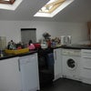 Photo 2: Kitchen lounge, L-R dishwasher, cooker, washing machine