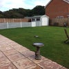 Photo 9: South facing rear garden with patio and seating
