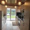 Photo 3: Kitchen with river view and door on to decking 