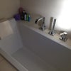 Photo 4: View of the bathtub in the bathroom