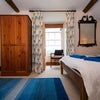 Photo 2: Large attic room, with arms chair, side table and open fire