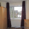 Photo 3: Furnished room with bed, double wardrobe, chest or drawers.