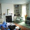 Photo 4: The sitting room, like all the rooms, is huge