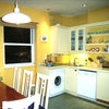 Photo 5: The kitchen has plenty of dining space; the table can seat 8 people