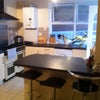 Photo 3: Large kitchen with breakfast bar and extractor hood