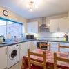 Photo 5: SPACIOUS MODERN FULLY~EQUIPPED KITCHEN WITH DINING TABLE & CHAIRS 