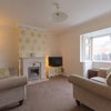Photo 7: SITTING ROOM WITH SOFA, ARMCHAIR & SMART TV .