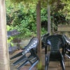 Photo 4: Patio area with ample seating, table and BBQ