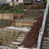 Photo 4: Front of house showing access via steps