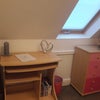 Photo 6: Computer Desk with adjustable table and foldaway seat, as well as a TV with a selection of DVDs  