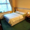 Photo 2: Bookshelf, Double bed, bedside table, lamp, alarm clock