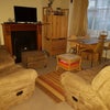 Photo 6: Shared living/dining room with storage.