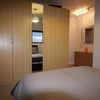 Photo 1: Master Bedroom - 5 door mirrored wardrobe, large wall mirror, large chest of drawers