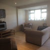 Photo 2: sitting room towards front entrance and door