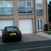 Photo 7: Front of House with Car Parking