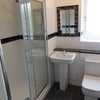 Photo 1: Well maintained communal Bathroom with new electric shower. 