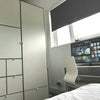 Photo 8: Smart TV and wardrobe with ample storage