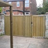 Photo 6: Yard with seating area, bike storage and secure alley gates