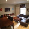 Photo 7: Living room with leather sofas, large dining table and plasma TV, WC adjoining