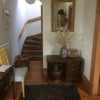 Photo 6: The entrance hallway and stairs to lodger's room