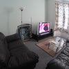 Photo 2: Living Room With Large TV