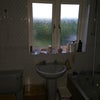 Photo 3: The badly lit bathroom