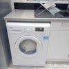 Photo 5: Washing machine located in the kitchen