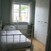 Photo 2: Single room with white metal day-bed