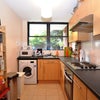 Photo 2: bright kitchen overlooking the garden